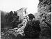 British Troops Wary of German Snipers Move Cautiously Behind a Ruined Wall in St. Mau...