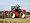 4 Wheel Drive Tractor Pulling a Disc Harrow, Cotswolds, England Photographic Poster Print by Martin Page, 18x24