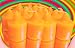 One Dozen Partylite GINGER PUMPKIN Votive Candles Image
