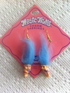 Magic Troll Holding star Earrings with Blue Hair