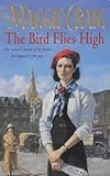 The bird flies high