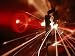Red Laser Light Focused Through Lens Blasts Pin Point Hole Through Razor in Thousandt...