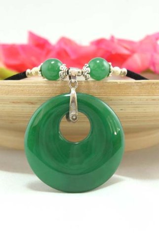 Click here to buy Emerald Jade Circle Pendant on a Black Velvet Rope Choker Necklace Pendant Size: 1.85 Necklace....