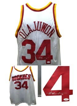 Signed Hakeem Olajuwon Houston Rockets Jersey JSA COA Hakeem Olajuwon autographed home white Houston Rockets jersey. RARE ITEM!!! 2 X NBA Champion with the Houston Rockets and Hall of Famer. Comes with James Spence Authentication (JSA) COA, with a numbered hologram on item and COA verified online + photo from signing. Size XL jersey, everything sewn on.