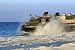 An Assault Craft Heads Back to Sea after Dropping off Cargo during an Offload. - 24