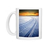 Snowmobile tracks on a snowy frozen lake Photo Mugs