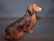 Longhair Dauchshund Sitting Red Dog Figure Dogs & Pups Galore Figurine