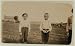 Photo Boy on left is Arthur Pugh. Said he made bands 25 cents a day in Starkville, Miss. Cotton Mill. Boy on right worked