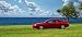 Red Sport Car Parked on Fantastic Coast - 24W x 11H - Peel and Stick Wall Decal by Wallmonkeys