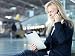 Wallmonkeys Peel and Stick Wall Decals - Nice Business Women Working at the Airport with Mobile Device - Removable Graphic