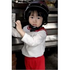 Poster 40 x 60 cm - "Portrait of child wearing motorcycle helmet." von Philip Game / Lonely Planet Images - auch in anderen Gr��en und als Leinwandbild erh�ltlich