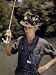 Fisherman Wears a Hat Covered with Fishing Lures and Flies Photographic Poster Print by B. Anthony Stewart, 18x24