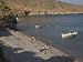 People on a Pebble Beach Seen from Afar with Fishing Boats on Sea, Kato Zakro, East Coast, Greece Photographic Poster Print by Eitan Simanor, 12x9
