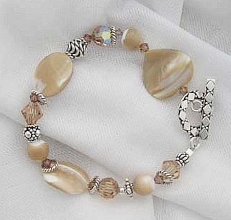 Click here to buy Mother-of-Pearl and Tan Swarovski Crystal Bracelet.