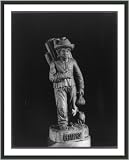 Historic Print (L): [Wood sculpture by Joaquin Aguilar Guzman of a mat seller, carrying bundle on his back]