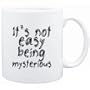 Mug White " It's not easy being mysterious " Adjetives
