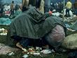Several Youths Huddled under a Green Tarp, During the Woodstock Music and Art Fair Artists Photographic Poster Print by John Dominis, 18x24