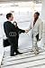 Wallmonkeys Peel and Stick Wall Decals - Two Handsome Business Men Shaking Hands to Confirm a Deal - Removable Graphic