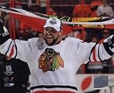 Dustin Byfuglien with Chicago Blackhawks Flag 2010 Stanley Cup Finals (#35) - Licensed Photo by PhotoFile (8x10)