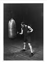 Historic Print (S): Corbett punching the bag to get in condition to handle Jeffries for the championship fig