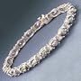 7"14k White Gold Oval Celestial Topaz Line Bracelet With Double Diamond Spacers