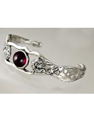 A Sensational Sterling Silver Goddess Cuff Bracelet Featuring A Genuine Garnet