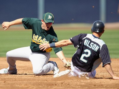 Oakland Athletics v Seattle Mariners, PEORIA, AZ - MARCH 12: Cliff Pennington and Jack Wilson Photographic Poster Print by Christian Petersen, 24x32