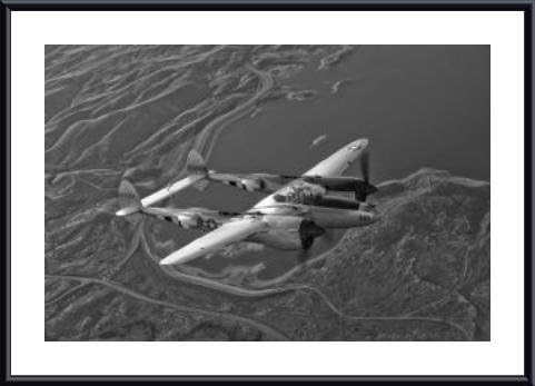 A Lockheed P-38 Lightning fighter aircraft in flight., framed black metal, white matte 20 x 16 Inches.