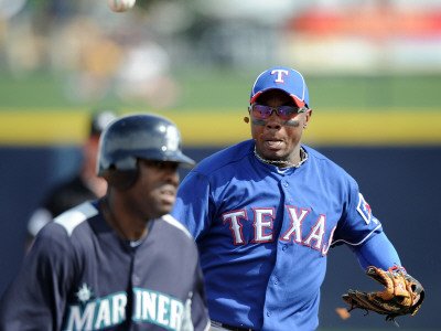 Texas Rangers v Seattle Mariners, PEORIA, AZ - MARCH 01: Esteban German and Milton Bradley Photographic Poster Print by Harry How, 12x16