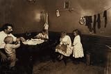 1912 child labor photo Annie Fedele crocheting on underwear out in the filthy back yard. This is one