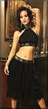 Chiffon Skirt with Sequin Trim and Chiffon Layers and Hidden Side Zipper. Top has Sequin Trim and Adjustable Hook and Eye Back Closure. Can be Worn as a Skirt and Top or as a Mini Dress. Sizes Small, Medium or Large in Black.