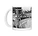 A dog driving a vintage car Photo Mugs