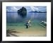 Bangka (Boat) Leaves Shores of Malapacao Island, Bacuit Archipelago, Palawan, Philippines Lonely Planet Collection Framed Art Poster Print by John Pennock, 31x25