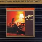 Click here to buy Backless by  Eric Clapton .