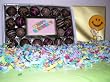 Happy Birthday Chocolate Bar surrounded by 20 Award WinningTruffles complete with a Chocolate Smile Face Lollipop