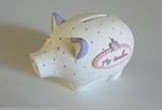 Tirelire cochon pois mauve