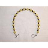 8&1/8th Bracelet with 6mm Peridot Jasper & 4mm Blue Goldstone Strung on 7 Strand Beading Wire Finished with Sterling Silver Crimps & Covers and a 10mm Antiqued Pewter Toggle Clasp