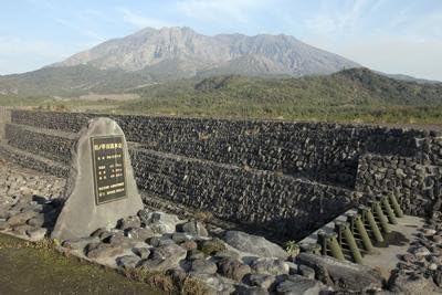 Sabo Channel at Haramatsu River with Tubular Grid Dam and Sakurajima Volcano Wall Decal - 52 Inches W x 35 Inches H - Peel and Stick Removable Graphic