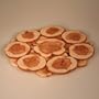 JUNIPER WOOD PRODUCTS/FROM SIBERIA WITH LOVE TRIVET [Made in Russia. Material: juniper wood. Diameter: 10.4 inches (26 cm). A natural product without a lacquer coating, saturated with an inimitable, delicate perfume. It is polished with an ancient technique, using pieces of wood, so the hue remains bright for many years] [This wooden trivet gracefully finds the balance between organic beauty and modern functionality. The coaster is handmade in Siberia from richly scented juniper wood, and its earthy simplicity makes it a great addition to any decor. Experience a soothing scent when you put a hot teapot on the coaster. Products made from juniper wood are not only beautiful, but contain the enormous energy potential of the wood from which they are made. Juniper trees have been growing for over a thousand years, accumulating strength and energy. The smell of juniper wood stimulates and restores mental equilibrium, prevents the spread of infectious diseases, cleans and freshens the air, clears the senses, and imparts internal strength. The aroma of juniper wood is spicy yet smooth. Since ancient times, juniper wood has been used to fumigate rooms in times of epidemics]