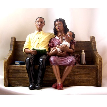 African American Church Couple with Baby in Pew