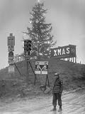 Lit Merry Christmas Sign Behind Christmas Tree and Signal Battalion at the Top of Radicosa Pass Photographic Poster Print