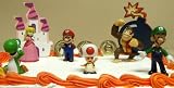 Mario Brothers 23 Piece Birthday Cake Topper Set Featuring Mario Castle, Bomb, Mario Coins, 6 Mario Figures Including Mario, Luigi, Princess Peach, Toad, Yoshi, Donkey Kong, and 12 Mario 1