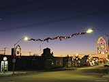 IMAGE OF A Twilight View of a Small Town Street Decorated for Christmas Premium Photographic Poster Print, 24x32