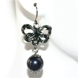 Elegant flower shaped earings with single black drop