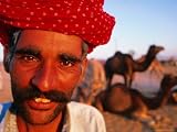 Rajput Camel Driver at Pushkar Camel Fair, Looking at Camera, Pushkar, India Photographic Poster Print by Paul Beinssen, 24x18