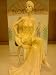 broadway belles - lady sitting on chair figurine