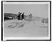 [A group of tourists explore a geyser in the Upper Geyser Basin in Yellowstone Nation...