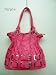 This multiuse shoulder bag spotlights rich leather like exterior with roomy interior space. The