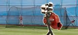 BaseHit & PowerAlley System Real Ball Pitching Machine & 22 x 12 x 10 Home Batting Cage Combina