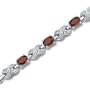 Luxurious 1.75 carats total weight Oval Cut Garnet & White CZ Gemstone Bracelet in Sterling Silver